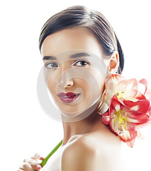 Young pretty brunette woman with red flower amaryllis close up isolated on white background. Fancy fashion makeup