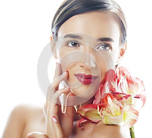 Young pretty brunette woman with red flower amaryllis close up isolated on white background. Fancy fashion makeup