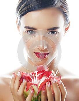 Young pretty brunette woman with red flower amaryllis close up isolated on white background. Fancy fashion makeup