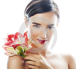 Young pretty brunette woman with red flower amaryllis close up isolated on white background. Fancy fashion makeup