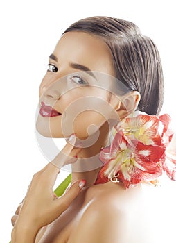 Young pretty brunette woman with red flower amaryllis close up isolated on white background. Fancy fashion makeup