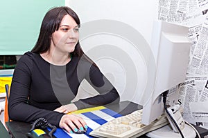 Young pretty business woman with computer