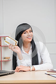 Young pretty business woman sitting at the desk