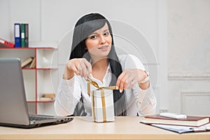 Young pretty business woman sitting at the desk