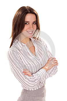 Young pretty businesswoman with arm folded.