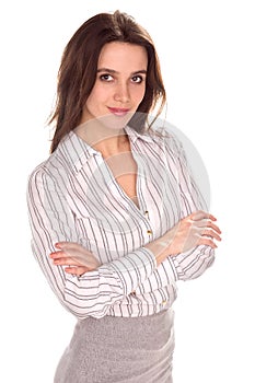 Young pretty businesswoman with arm folded. Full height portrait