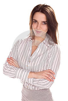 Young pretty businesswoman with arm folded. Full height portrait