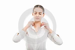 Young pretty bussines woman arranging collar shirt gesture photo