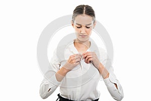 Young pretty bussines woman buttoning shirt gesture photo