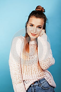 Young pretty caucasian teenage girl smiling happy on blue background, lifestyle people concept