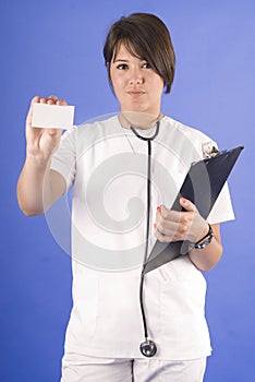 Young and pretty doctor with stethoscope and card