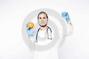 Young pretty doctor with stethoscope holding fruits, vegetables and pills, syringe, healthy food care concept