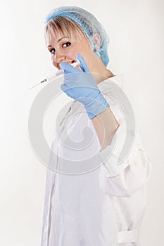 Young pretty doctor with syringe