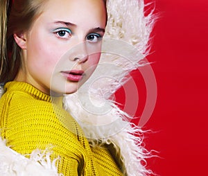 young pretty emitonal posing teenage girl on bright red background, happy smiling lifestyle people concept