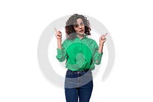young pretty european brunette woman with curly hairdo in green shirt