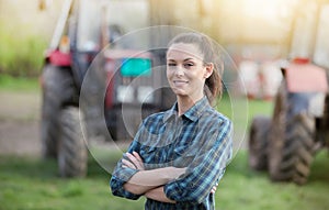 Farmer woman with tractors on farmland photo