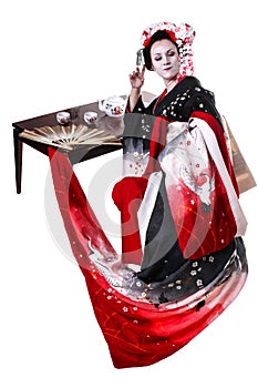 Young pretty geisha in kimono with sakura and decoration