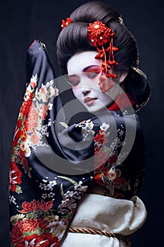 Young pretty geisha in kimono