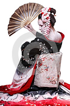 Young pretty geisha in kimono with sakura and decoration