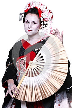 Young pretty geisha in kimono with sakura and decoration