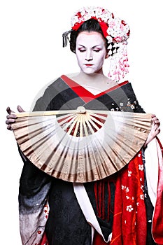 Young pretty geisha in kimono with sakura and decoration