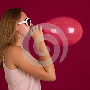 Young pretty girl with balloon, party