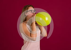 Young pretty girl with balloon, party
