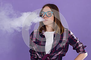 Young pretty girl with electronic cigarette