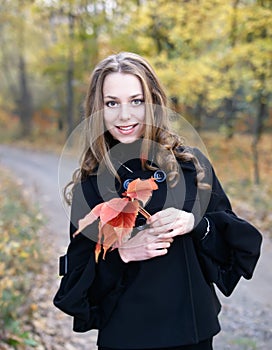 Young pretty girl in fall forest