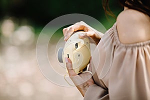 Close up Portrait of beautiful woman with nstax camera.