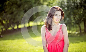 Young pretty girl in park in spring
