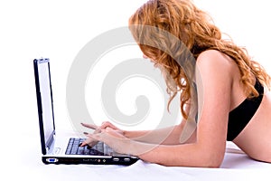 Young pretty girl using laptop computer.