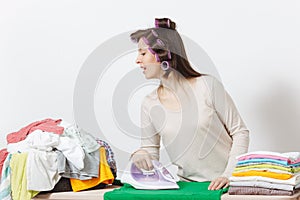 Young pretty housewife. Woman on white background. Housekeeping concept. Copy space for advertisement.