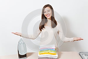 Young pretty housewife. Woman isolated on white background. Housekeeping concept. Copy space for advertisement.