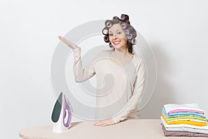 Young pretty housewife. Woman isolated on white background. Housekeeping concept. Copy space for advertisement.