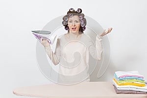 Young pretty housewife. Woman on white background. Housekeeping concept. Copy space for advertisement.