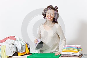 Young pretty housewife. Woman on white background. Housekeeping concept. Copy space for advertisement.