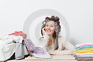 Young pretty housewife. Woman on white background. Housekeeping concept. Copy space for advertisement.