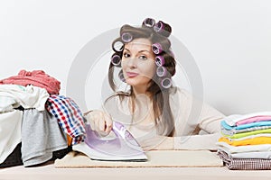 Young pretty housewife. Woman on white background. Housekeeping concept. Copy space for advertisement.