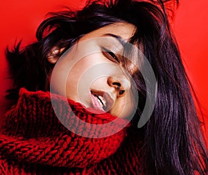 Young pretty indian mulatto girl in red sweater posing emotional, fashion hipster teenage, lifestyle people concept