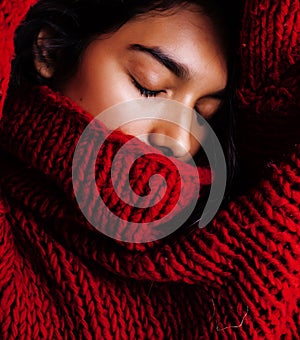 Young pretty indian mulatto girl in red sweater posing emotional, fashion hipster teenage, lifestyle people concept