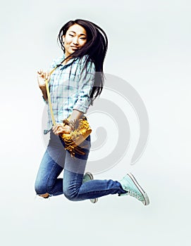 Young pretty jumping asian woman posing cheerful emotional isolated on white background, lifestyle people concept