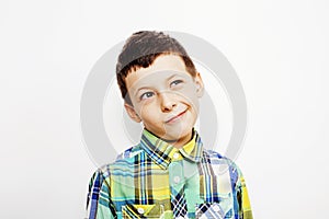 Young pretty little boy kid wondering, posing emotional face isolated on white background, gesture happy smiling close