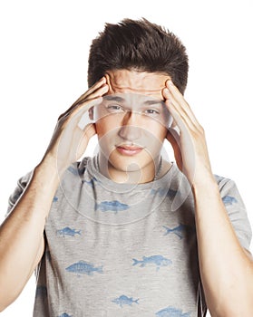 Young pretty man with head ache holding hands