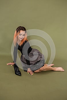 young pretty model posing for a photo shoot in a beautiful new spacious studio.