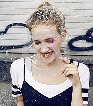 young pretty party girl smiling covered with glitter tinsel, fashion dress, stylish make up, lifestyle people concept