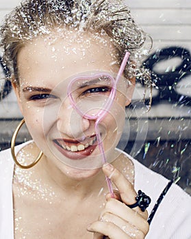 young pretty party girl smiling covered with glitter tinsel, fashion dress, stylish make up, lifestyle people concept