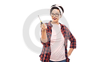 Young pretty pin-up girl holding screwdriver