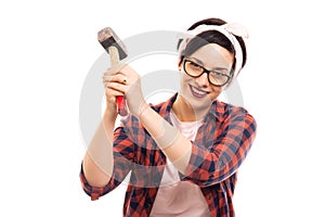 Young pretty pin-up girl showing strike hammer