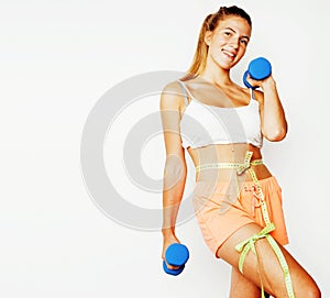 Young pretty slim blond woman with dumbbell isolated cheerful sm